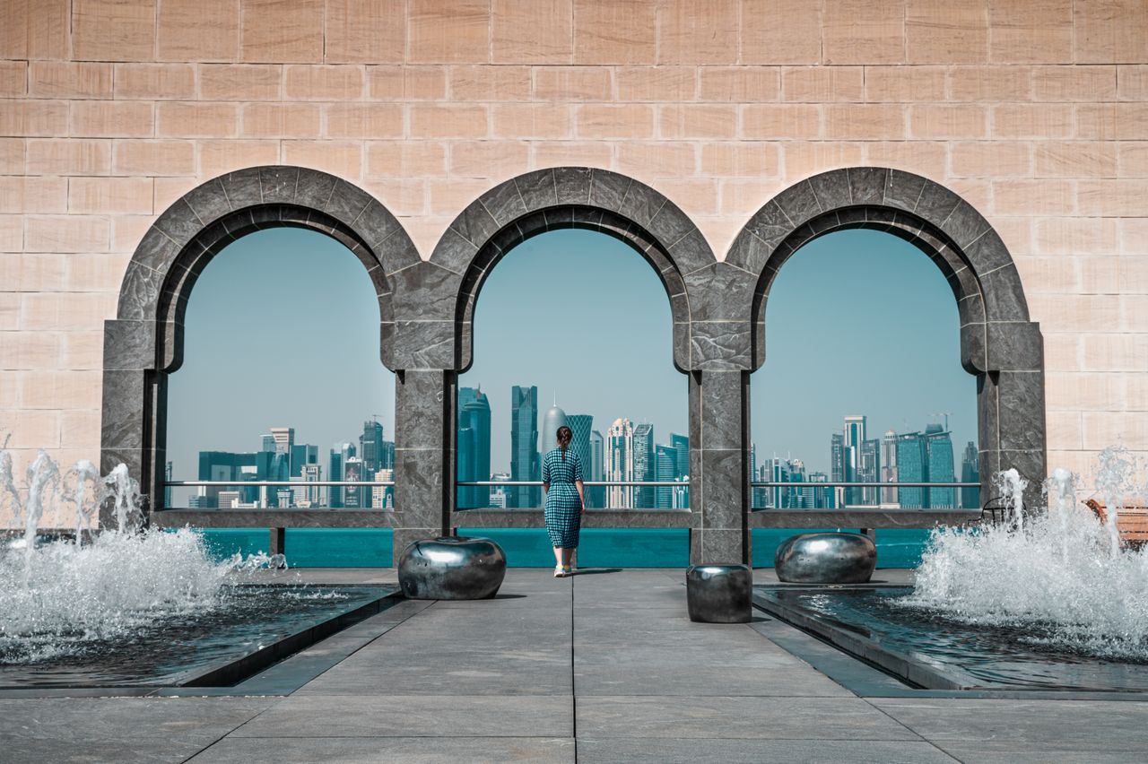 View of Doha skyline through Islamic arches at Museum of Islamic Art, Qatar.